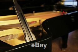 A 1955, Steinway Model D concert grand piano with a black case. Made in Hamburg