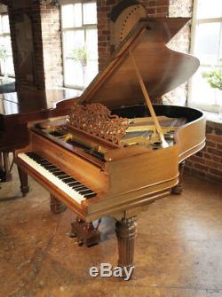 Antique, Steinway Model A grand piano with a walnut case and fluted, barrel legs