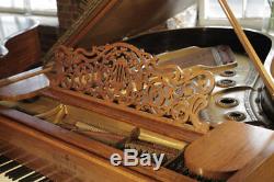 Antique, Steinway Model A grand piano with a walnut case and fluted, barrel legs